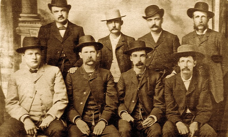 The Dodge City Peace Commission photographed by Conkling Studio in Dodge City, Kansas, in June 1883. The group includes Charlie Bassett, Wyatt Earp, Luke Short, Bat Masterson, and others.